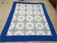 BLUE AND WHITE CROSS STITCHED QUILT