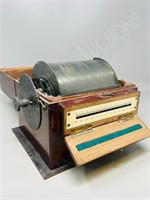 antique mahogany case with revolving drum