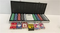 Various playing cards and a poker set. Contents