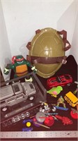 Hummer toy on display, Ninja turtle shield