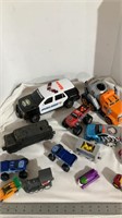 Assorted toy cars, trucks and trains