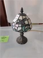Small lamp with humming bird on it