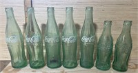 7- Vintage Coke Bottles