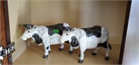 Two Wood carved cows