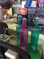 Set of three decorative glass bottles