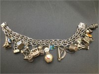 Vintage 8" sterling charm bracelet with 18 charms