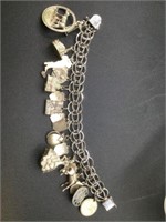 Vintage 8" sterling charm bracelet with 19 charms