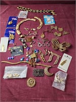 Assorted zipper pulls and jewelry pieces