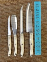 3 used Cutco Knives and 1 spatula, white handle