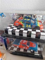 Model racecar collectibles in cases