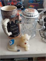 Cat figurine with German Stein mugs