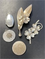 Five Sterling Pins and Lockets
