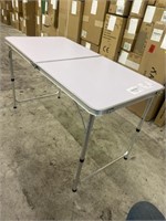 Gently used 24x48 inch adjustable camping table.