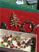 Lock box of vintage Christmas jewelry