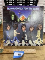 Francois Glorieux plays the Beatles record album