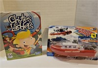 Toy lot. Rescue boat, chutes and ladders game.