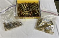 ASSORTED AMMO AND BRASS IN CIGAR BOX