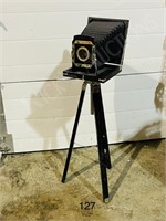 modern decorative camera on tripod
