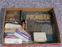 Box of miscellaneous car parts including wheel
