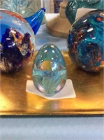 Small glass egg paperweight