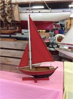 Small red sail sailboat