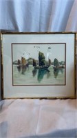 A framed print of sailboats in the water