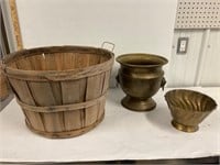 Bushel basket and brass pots.
