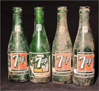 4 painted label 7 up bottles.
