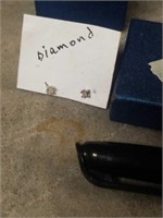 Very small what could be diamond earrings