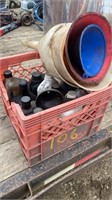 Crate of oil  and funnels