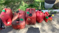 Gas cans (4) & (1) Boat Tank