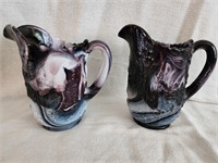 2 Imperial slag glass pitchers.  Approximately