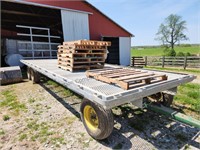 Metal floor hay wagon, with Badger running gear