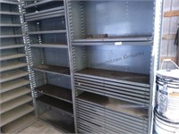 Two metal shelving units with the adjustable