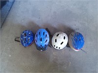 Four helmets for dirt bikes and more