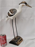 Carved Egret stand on piece of wood. Look at the