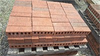 pallet of red brick.  Bricks are approximately