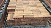 Pallet of red brick. Bricks are approximately