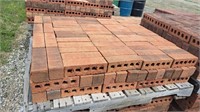 Pallet of red brick. Bricks are approximately