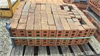 Pallet of banded red brick.  Bricks are