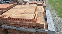 Pallet of red brick.  Bricks are approximately