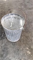 Metal trash can. Approximately 15 across x 18