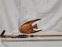 Cane with snake coiled around shaft and a wood