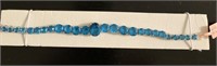 Blue topaz silvertone line bracelet (7.50 in)