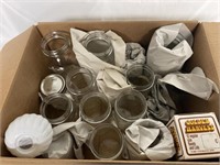 A box full of mason jars and mason lids