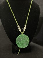 Carved medallion green necklace