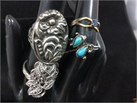 Turquoise colored stones, silver tone rings