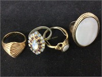 Gold and ivory colored rings