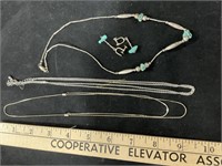 Silver colored necklaces, earrings
