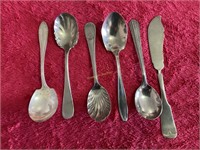 Decorative serving spoons and knife